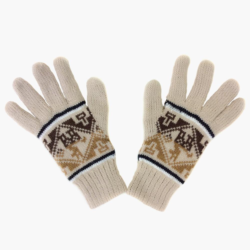 A pair of blue knitted gloves with geometric patterns on a white wooden surface.