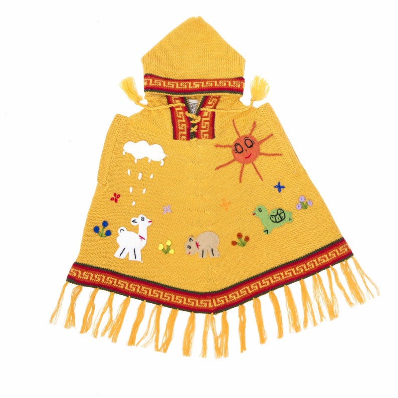 A yellow children's poncho with a hood, featuring decorative elements such as a sheep, sun, rain, and stars.
